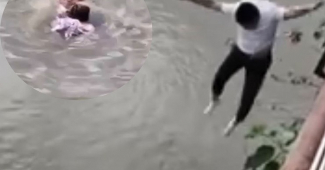 Người đàn ông nhảy xuống dòng sông chảy xiết cứu bé gái